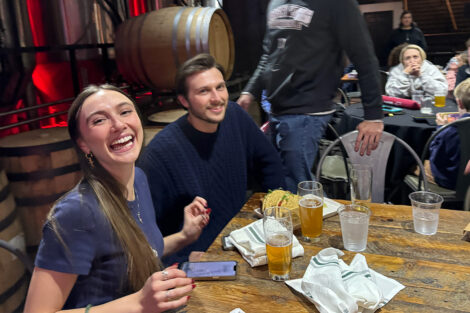 A group of alumni are seated at a table