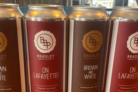 Two beer cans - one reads On Lafayette and the other reads Brown and White